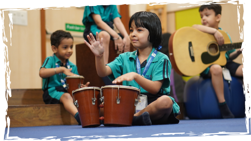 Children playing drums at Manthan